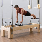 Balanced Body Reformer Trapeze Combinatie tijdens professionele planktraining